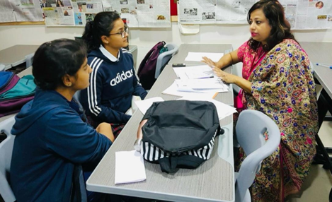 Abanita guiding a student through a one-to-one counselling session